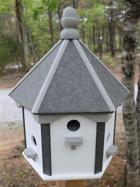 outside bird houses on post